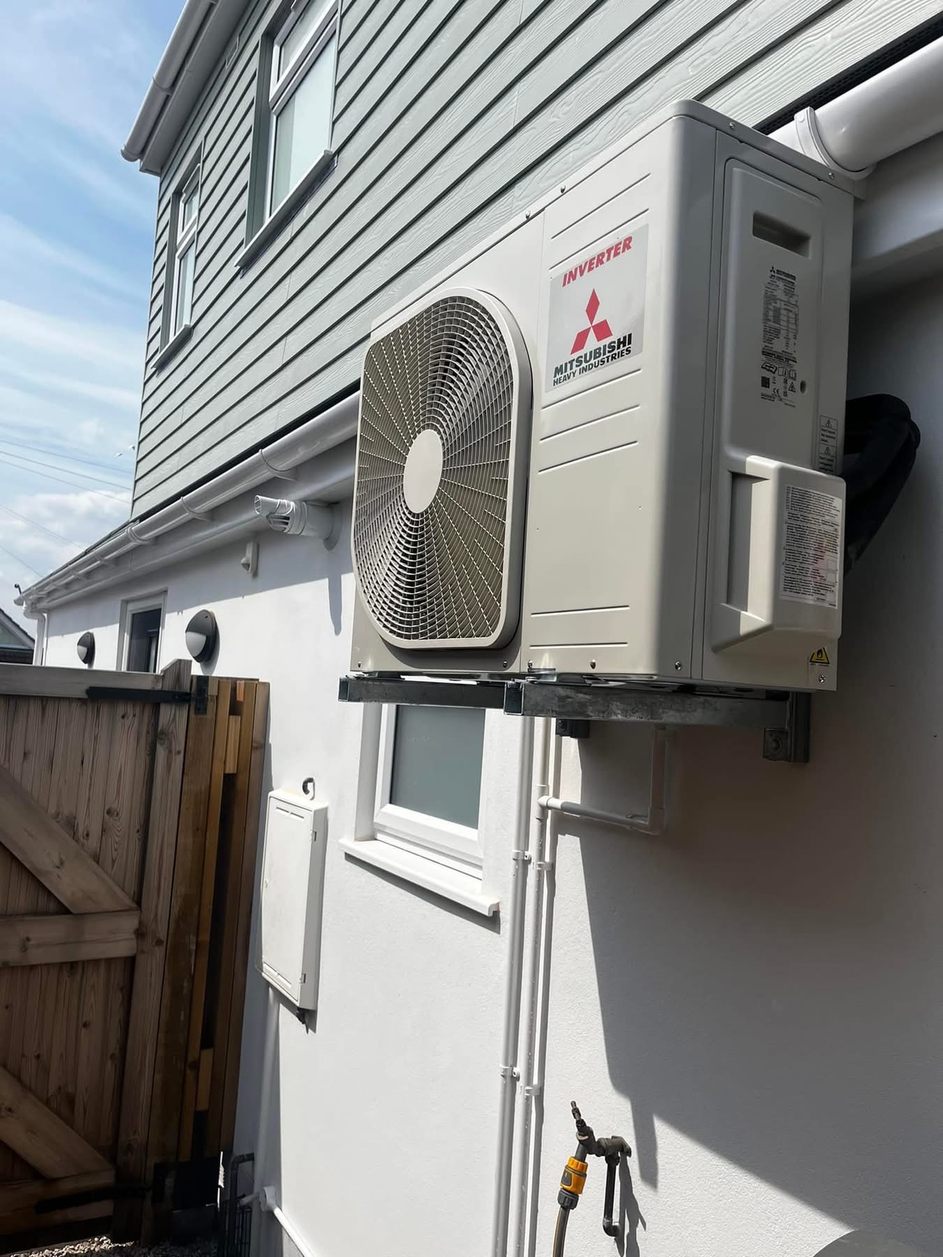 Mitsubishi outdoor AC unit installed at a Bournemouth home